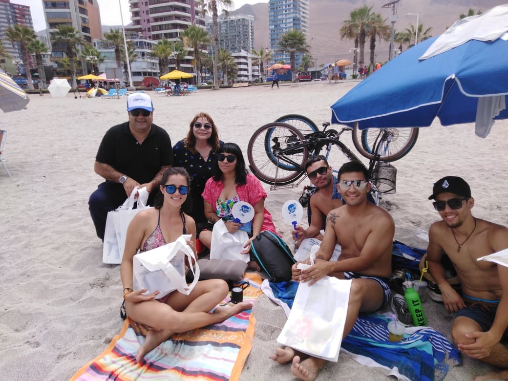 Difundieron Fonos 1455 de Violencia Contra la Mujer y Denuncia Seguro 600 400 01 01 en Playa Cavancha